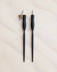 two calligraphy pens in black with oblique and straight nibs