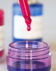 Make Your Own Ink gift set a close up of the dropper lid dripping into an ink jar