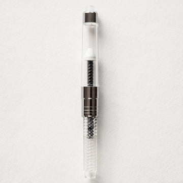 Refillable ink converter for a fountain pen