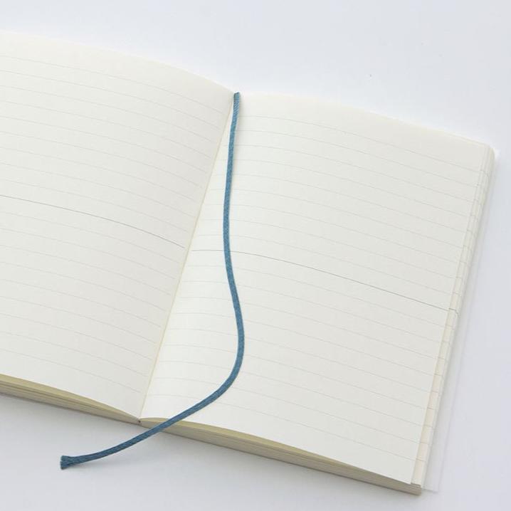 The MD Notebook Journal - open on a table with marker ribbon