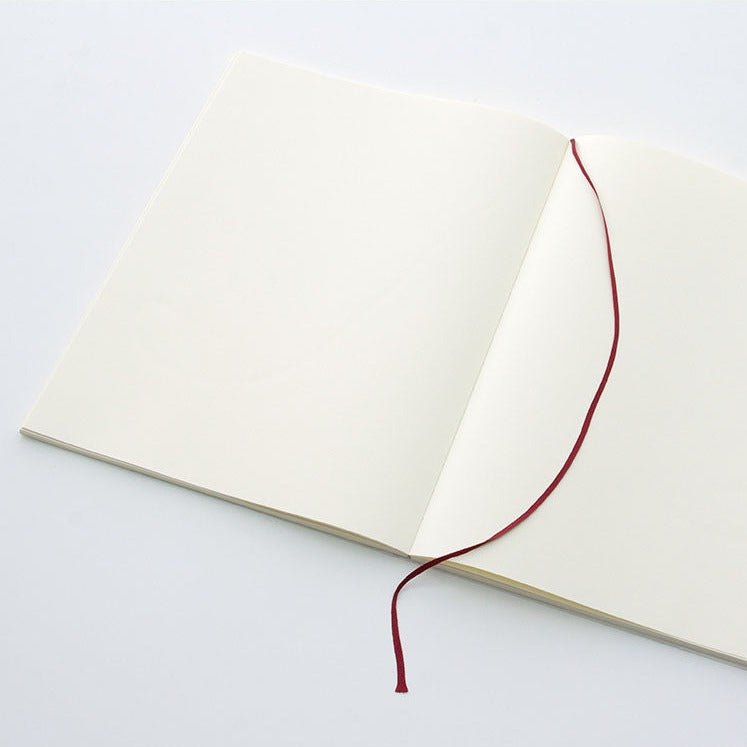 The MD Notebook Sketcbook - open on a table with marker ribbon