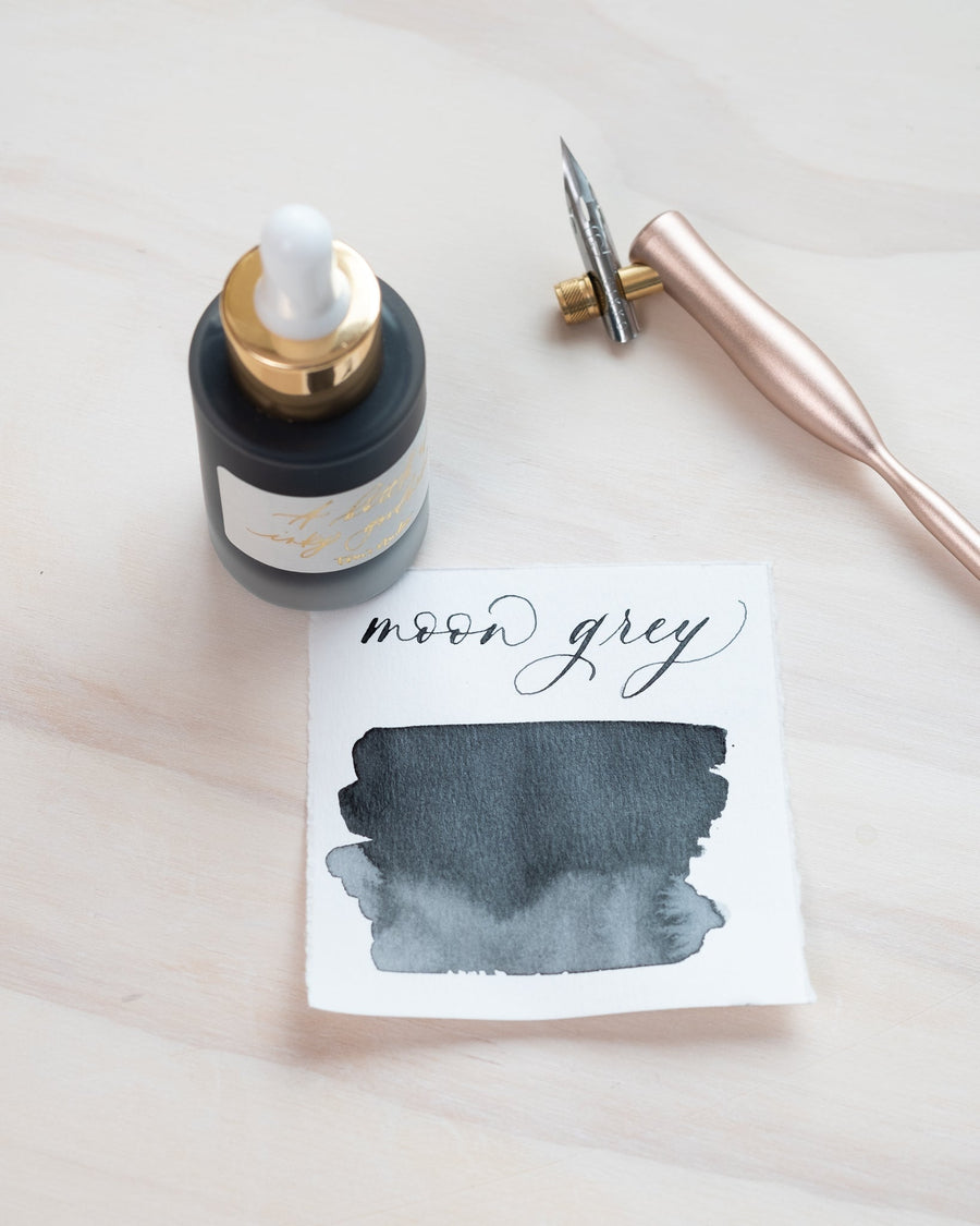 Moon Grey - Calligraphy Ink in bottle with swatch showing the ink colour