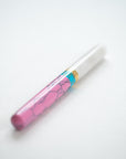 Pink + Turquoise Studio Fountain Pen with a flexible nib close up on a white deskl
