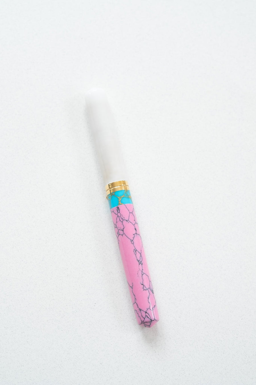 Pink + Turquoise Studio Fountain Pen with a flexible nib with the white lid on