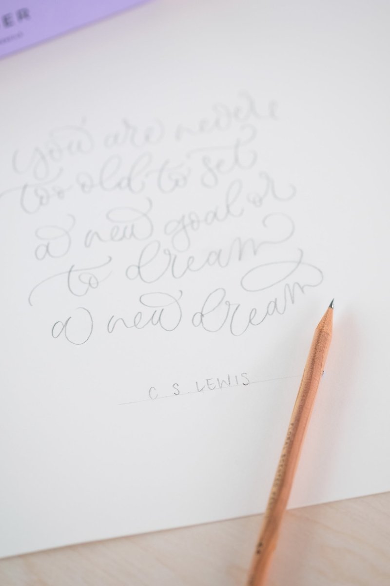 Cursive writing in pencil on cartridge paper with a scented pencil