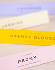 Peony scented pencils in their box with other scents in the background