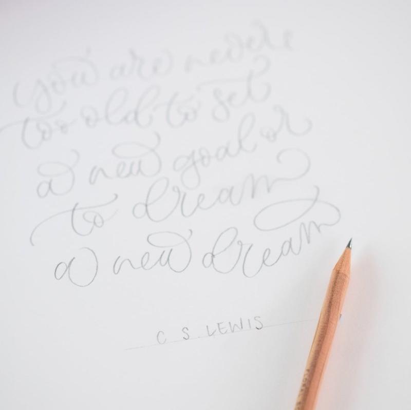 Cursive writing in pencil on cartridge paper with a scented pencil