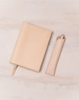 Leather Pen Sleeve for the Lumos Pro in Natural shown with matching leather notebook cover and the Studio Fountain Pen in Blush