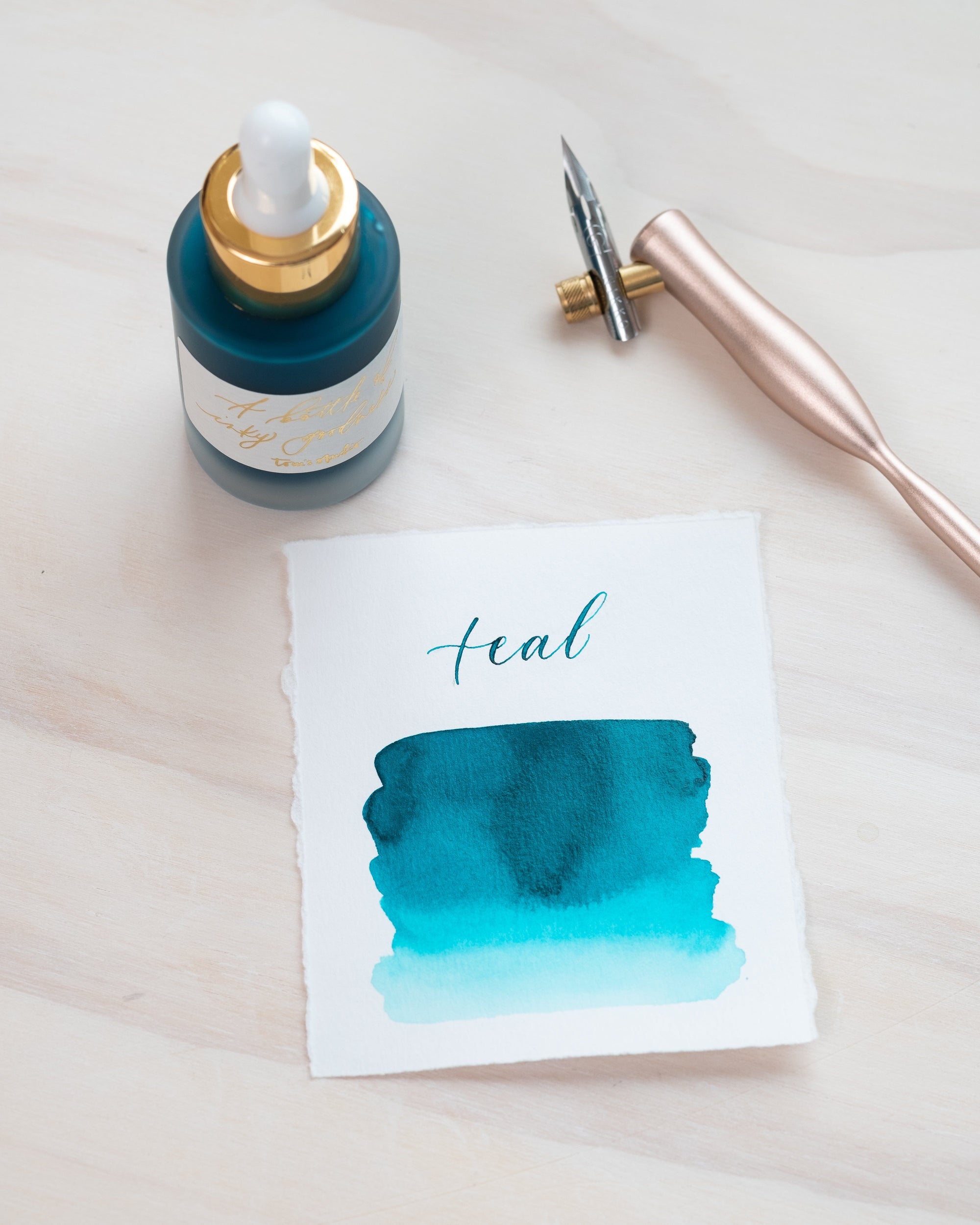 Teal - Calligraphy Ink in bottle with swatch showing the ink colour