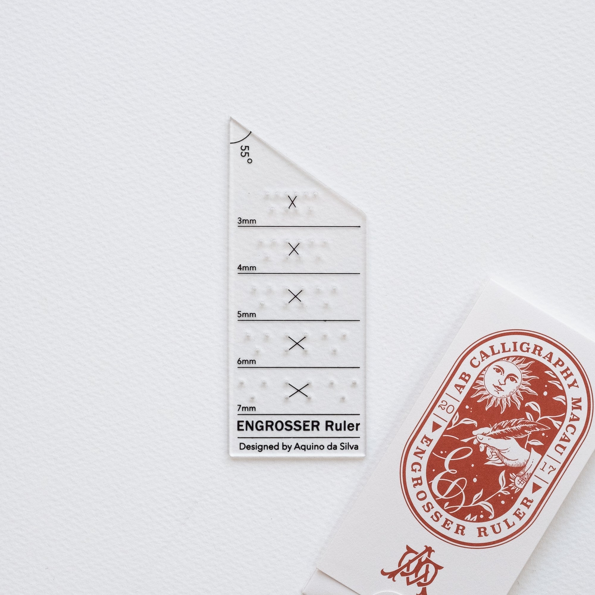 The Engrosser calligraphy ruler on paper with it&#39;s beautiful packaging
